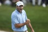 Scottie Scheffler pumps his fist after sinking a putt on the 18th green to win the Memorial golf tournament, Sunday, June 9, 2024, in Dublin, Ohio. (AP Photo/Sue Ogrocki)