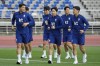 South Korea's Lee Kang-in, center, and teammates warm up during an open training session ahead of the second round of the Asian qualifier group C match for 2026 World Cup between South Korea and China, in Goyang, South Korea, Saturday, June 8, 2024. (AP Photo/Lee Jin-man)