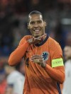 Netherlands' Virgil van Dijk celebrates scoring his side's 2nd goal during the international friendly soccer match between The Netherlands and Iceland at De Kuip stadium in Rotterdam, Netherlands, Monday, June 10, 2024. (AP Photo/Patrick Post)
