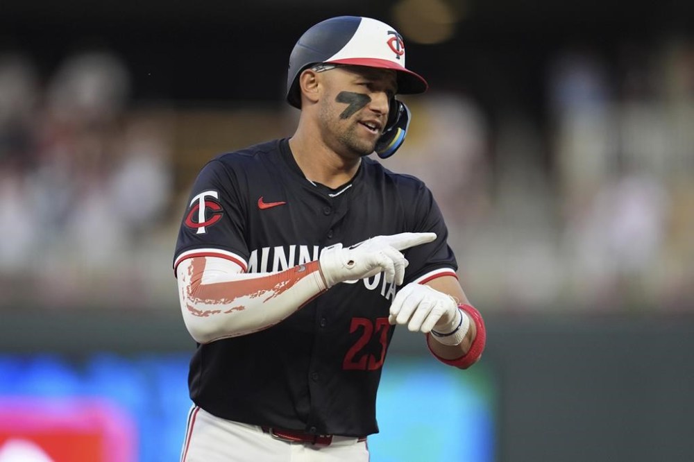 Minnesota Twins' Royce Lewis gestures while running the bases after hitting a two-run home run during the eighth inning of a baseball game against the Colorado Rockies, Monday, June 10, 2024, in Minneapolis. (AP Photo/Abbie Parr)