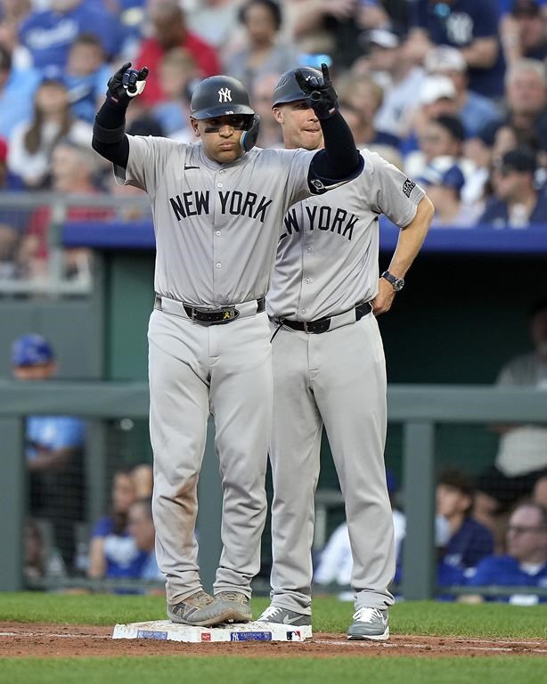 New York Yankees' Jose Trevino celebrates on first after hitting an RBI single during the fourth inning of a baseball game against the Kansas City Royals Monday, June 10, 2024, in Kansas City, Mo. (AP Photo/Charlie Riedel)