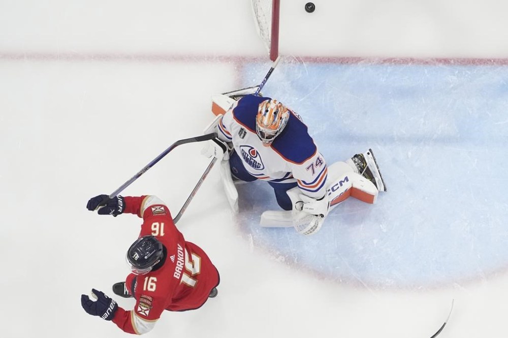Florida Panthers center Aleksander Barkov (16) celebrates after center Evan Rodrigues, not shown, scored against Edmonton Oilers goaltender Stuart Skinner (74) during the third period of Game 2 of the Stanley Cup Finals, Monday, June 10, 2024, in Sunrise, Fla. (AP Photo/Wilfredo Lee)