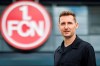 The new Bundesliga 2 FCN coach Miroslav Klose poses in front of the club logo in Nuremberg, Germany, Tuesday, June 11, 2024. (Daniel Karmann/dpa via AP)