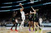 Phoenix Mercury guard Diana Taurasi goes up for a basket but doesn't make it against the defense from Seattle Storm center Ezi Magbegor, left, guard Victoria Vivians and guard Sami Whitcomb (32) during the second half of a WNBA basketball game, Tuesday, June 4, 2024, in Seattle. The Storm won 80-62. (AP Photo/Lindsey Wasson)