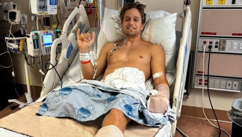 A professional kiteboarder from Prince Edward Island faces a long road to recovery after he lost his leg in a shark attack while snorkelling in the Turks and Caicos Islands in the last week of May. Lucas Arsenault gestures as he lies in a hospital bed in an undated handout image published to fundraising website GoFundMe. THE CANADIAN PRESS/HO-GoFundMe, *MANDATORY CREDIT*