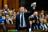 Conservative Leader Pierre Poilievre waves a document in the air as he rises during Question Period in the House of Commons on Parliament Hill in Ottawa on Wednesday, June 5, 2024. THE CANADIAN PRESS/Justin Tang