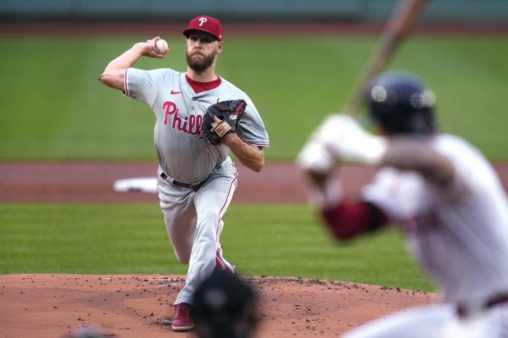 Philadelphia Phillies pitcher Zack Wheeler delivers to a Boston Red Sox batter during the first inning of a baseball game Tuesday, June 11, 2024, in Boston. (AP Photo/Charles Krupa)