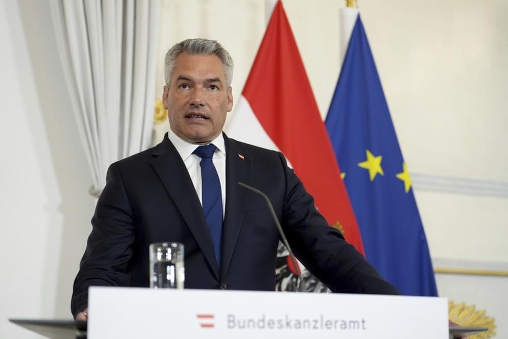 FILE - The Chancellor of Austria, Karl Nehammer speaks at a joint press conference with Prime Minister Rishi Sunak, at Federal Chancellery Ballhausplatz in Vienna, during a visit to Austria, on May 21, 2024. Austria’s government has formally set the date for the Alpine country’s next parliamentary election for Sept. 29. The date, which was announced Wednesday, June 12, 2024 was widely expected in the country of around nine million residents as it comes at the end of the current five-year-term. (Jordan Pettitt/pool photo via AP, File)