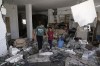 Palestinian girls sift through the rubble of a home destroyed in a raid by Israeli forces in the village of Kafr Dan, near the West Bank city of Jenin, Wednesday, June 12, 2024. Hundreds of mourners gathered for the funeral of Palestinian men killed by Israeli fire during a raid in the northern West Bank village. A total of six men were killed by Israeli forces during Tuesday's raid on the village according to the Palestinian Health Ministry. (AP Photo/Majdi Mohammed)