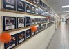 Framed team photos are on display in the hallway at Clearmeadow Public School in Newmarket, Ont. on Wednesday June 12, 2024. Pictures that feature former student Connor McDavid — now a star forward with the Edmonton Oilers — have matching orange balloons. THE CANADIAN PRESS/Gregory Strong