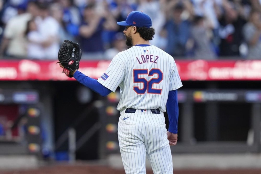 New York Mets pitcher Jorge López (52) reacts after Los Angeles Dodgers' Shohei Ohtani, of Japan, hit a two-run home run during the eighth inning of a baseball game, Wednesday, May 29, 2024, in New York. López will be cut by the struggling Mets after the reliever threw his glove into the stands following his ejection Wednesday at Citi Field. (AP Photo/Frank Franklin II)