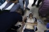 Palestinian medics treat a wounded youth in the Israeli bombardment on a residential building owned by the Jabr family in Bureij refugee camp, at al-Aqsa Martyrs Hospital in Deir al Balah, central Gaza Strip, Wednesday, June 12, 2024. (AP Photo/Saher Alghorra)