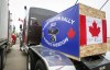 Anti-mandate demonstrators gather as a truck convoy blocks the highway at the busy U.S. border crossing in Coutts, Alta., Monday, Jan. 31, 2022. An undercover police officer is set to face more cross-examination today at the murder-conspiracy trial of two protesters at the border blockade at Coutts, Alta. THE CANADIAN PRESS/Jeff McIntosh