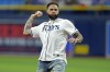Tampa Bay Buccaneers wide receiver Mike Evans throws out the ceremonial first pitch before a baseball game between the Tampa Bay Rays and the Chicago Cubs Wednesday, June 12, 2024, in St. Petersburg, Fla. (AP Photo/Chris O'Meara)