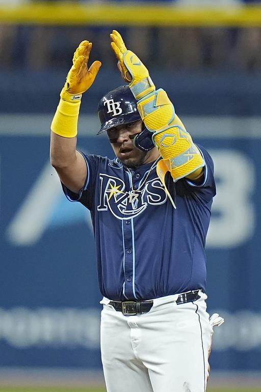 Tampa Bay Rays' Isaac Paredes celebrates after his RBI double off Chicago Cubs starting pitcher Javier Assad during the third inning of a baseball game Wednesday, June 12, 2024, in St. Petersburg, Fla. (AP Photo/Chris O'Meara)