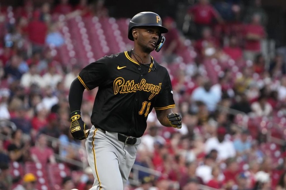 Pittsburgh Pirates' Michael A. Taylor heads to first on an RBI single during the fifth inning of a baseball game against the St. Louis Cardinals Wednesday, June 12, 2024, in St. Louis. (AP Photo/Jeff Roberson)