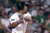 Boston Red Sox's Enmanuel Valdez watches his RBI double against the Philadelphia Phillies during the fifth inning of a baseball game Wednesday, June 12, 2024, in Boston. (AP Photo/Charles Krupa)