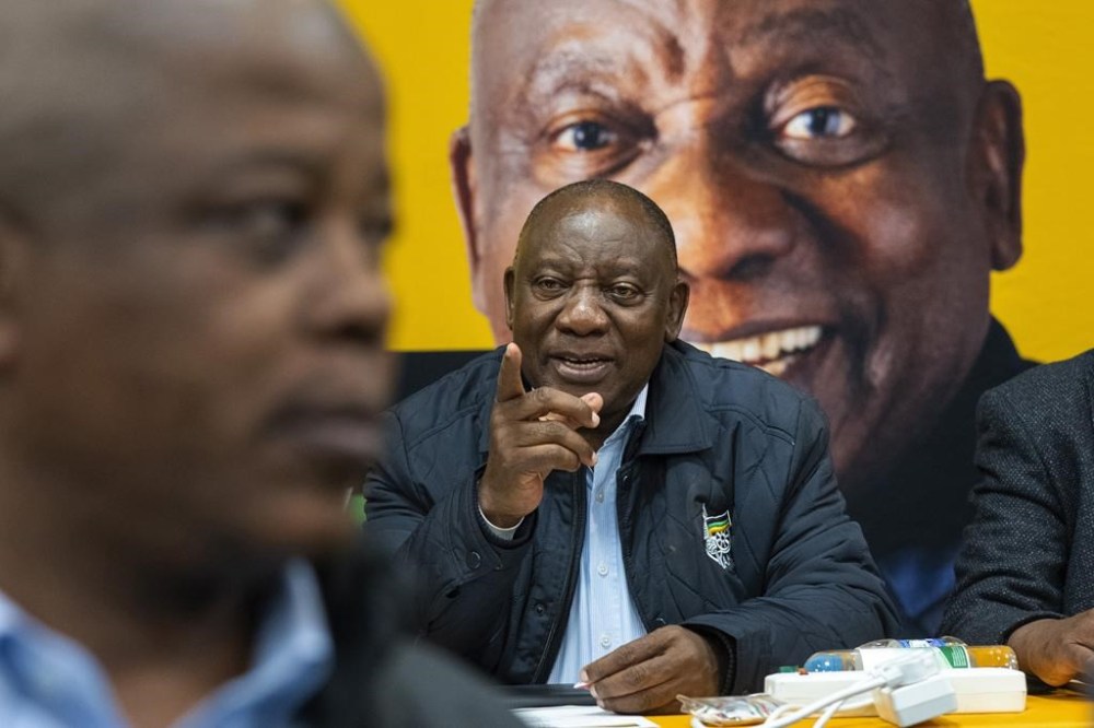 FILE - South African president Cyril Ramaphosa meets with senior officials of his African National Congress party during the ANC's National Executive Committee Thursday, June 6, 2024 in Johannesburg, South Africa. South African lawmakers are expected to elect the country's president on Friday, June 14 after being sworn in at the first sitting of Parliament that will also reveal the kind of unity government the ruling African National Congress has managed to cobble together after losing its majority for the first time since 1994. (AP Photo/Jerome Delay, File)