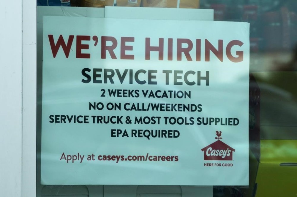 A hiring sign is displayed at a gas station in Vernon Hills, Ill., Monday, June 3, 2024. On Thursday, June 13, 2024, the Labor Department reports on the number of people who applied for unemployment benefits last week. (AP Photo/Nam Y. Huh)