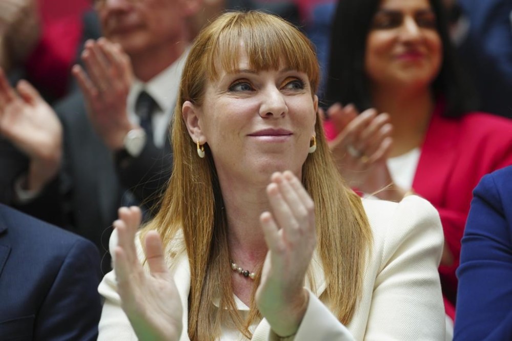 Britain's Angela Rayner Deputy Leader of the Labour Party applauds at the launch of The Labour party's 2024 general election manifesto in Manchester, England, Thursday, June 13, 2024. The election will take place on July 4. (AP Photo/Jon Super)