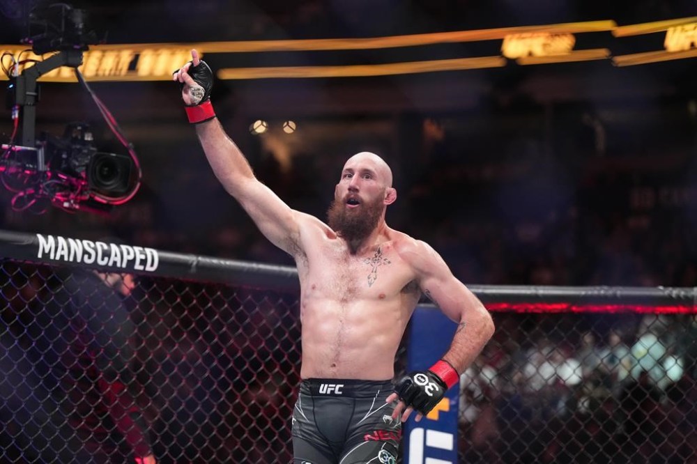 Kyle Nelson celebrates after his fight against Blake Bilder during a UFC 289 featherweight bout, in Vancouver on June 10, 2023. THE CANADIAN PRESS/Darryl Dyck