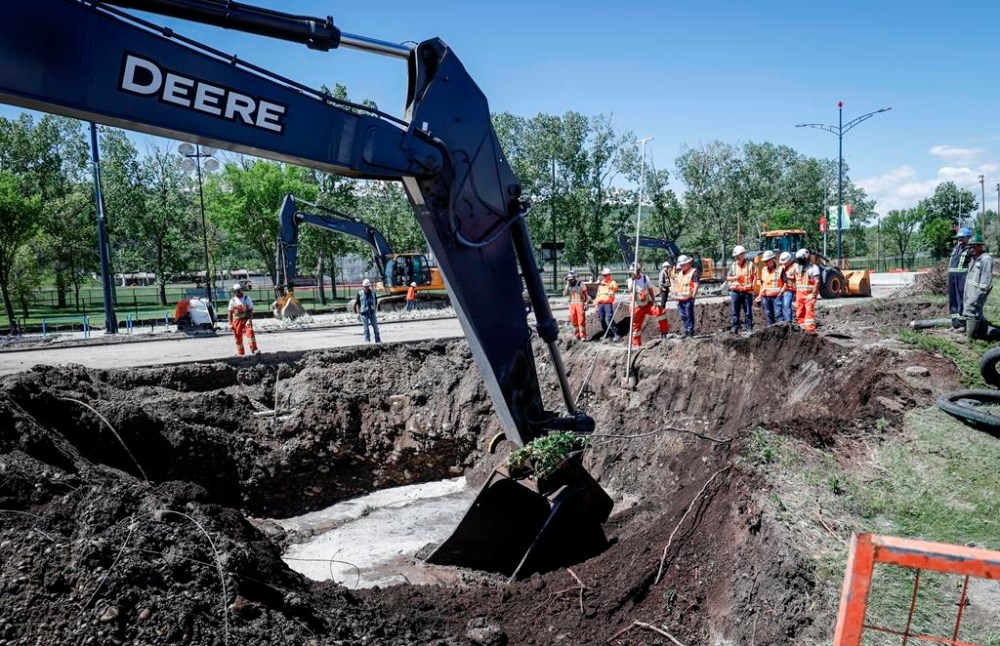 Calgarians are being urged to keep reducing their water use as work to repair a major water main stretches into a second day in Calgary, Friday, June 7, 2024. Repair work on a fractured Calgary water pipe has been paused after two workers were injured at the site last night. THE CANADIAN PRESS/Jeff McIntosh