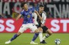 FILE - Japan's Hiroki Ito is challenged by Germany's Kai Havertz, right, during an international friendly soccer match between Germany and Japan in Wolfsburg, Germany, Saturday, Sept. 9, 2023. Bayern Munich has signed Japan defender Hiroki Ito from German rival Stuttgart in a move which is expected to mark the start of a wider overhaul of Bayern’s squad. (AP Photo/Martin Meissner, File)