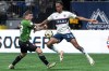 Cavalry FC's Fraser Aird, left, and Vancouver Whitecaps' Ali Ahmed (22) vie for the ball during the second half of a Canadian Championship quarterfinal soccer match in Vancouver on Tuesday, May 21, 2024. THE CANADIAN PRESS/Ethan Cairns