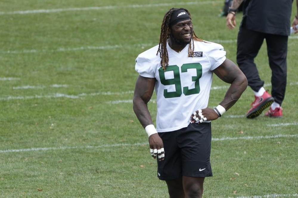 FILE - Defensive lineman Takkarist McKinley smiles during New York Jets practice at the NFL football team's training facility in Florham Park, N.J., Tuesday, June 11, 2024. The Jets signed McKinley after he had a tryout with the team during the its two-day minicamp. (AP Photo/Pamela Smith, File)