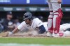 Detroit Tigers' Matt Vierling scores froom third on a sacrifice by Mark Canha during the seventh inning of a baseball game against the Washington Nationals, Thursday, June 13, 2024, in Detroit. (AP Photo/Carlos Osorio)