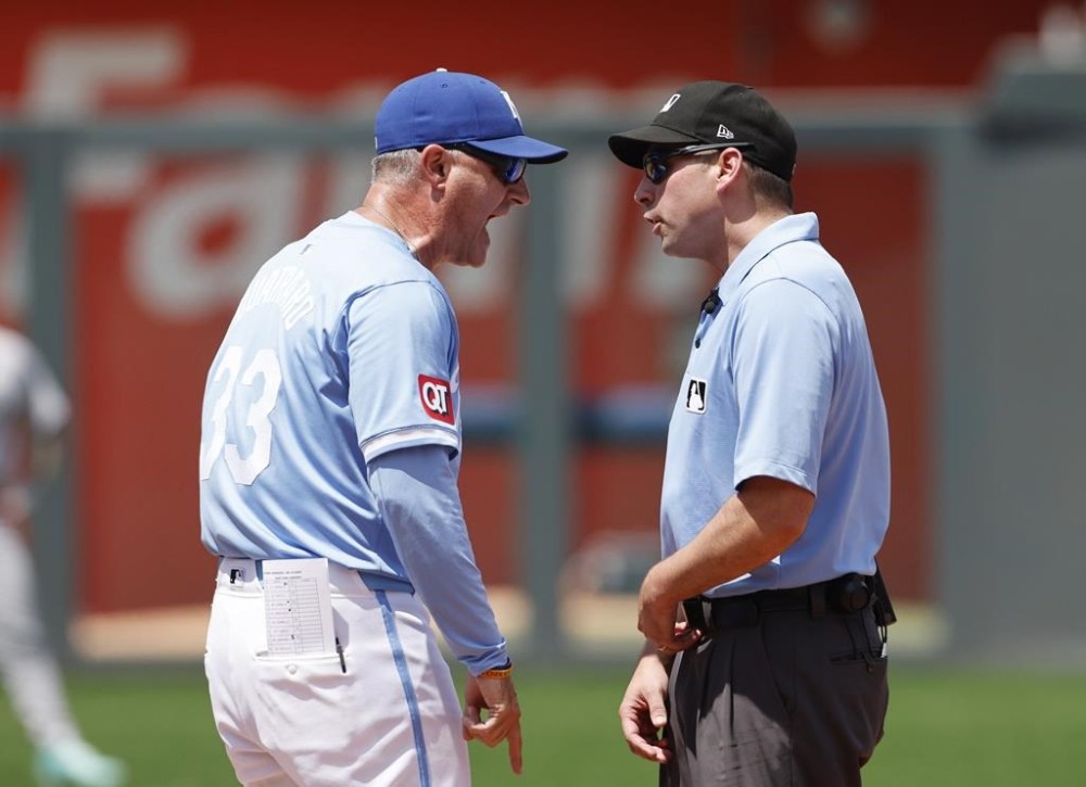 Kansas City Royals manager Matt Quatraro (33) argues a call by second base umpire Paul Clemons, right, during the sixth inning of a baseball game against the New York Yankees in Kansas City, Mo., Thursday, June 13, 2024. Quatraro was ejected from the game. (AP Photo/Colin E. Braley)