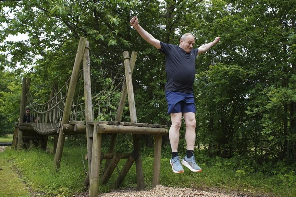 Britain's Liberal Democrats leader Ed Davey takes part in an assault course during a visit to Arena Pursuits in Wadhurst, Kent, England, Thursday, June 13, 2024, while on the general election campaign trail. (Gareth Fuller/PA via AP)