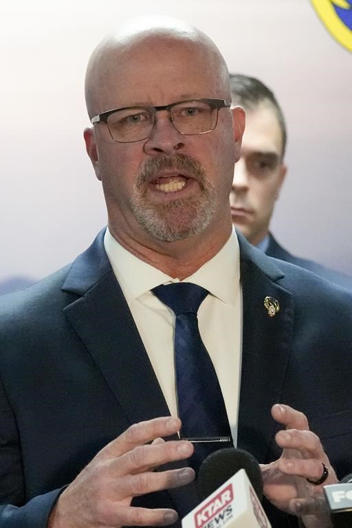 Darrell Kriplean, president of the Phoenix Law Enforcement Association, which represents about 2,200 Phoenix officers, answers a question during a news conference after the Department of Justice released their report on the department Thursday, June 13, 2024, in Phoenix. The Justice Department said that Phoenix police discriminate against Black, Hispanic and Native American people, unlawfully detain homeless people and use excessive force, including unjustified deadly force. (AP Photo/Ross D. Franklin)