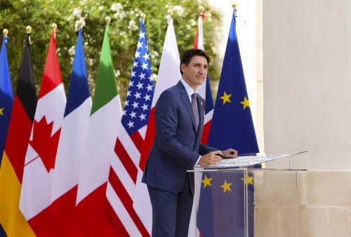 Prime Minister Justin Trudeau signs a G7 poster as he arrives to the G7 Summit in Savelletri Di Fasano, Italy on Thursday, June 13, 2024. THE CANADIAN PRESS/Sean Kilpatrick