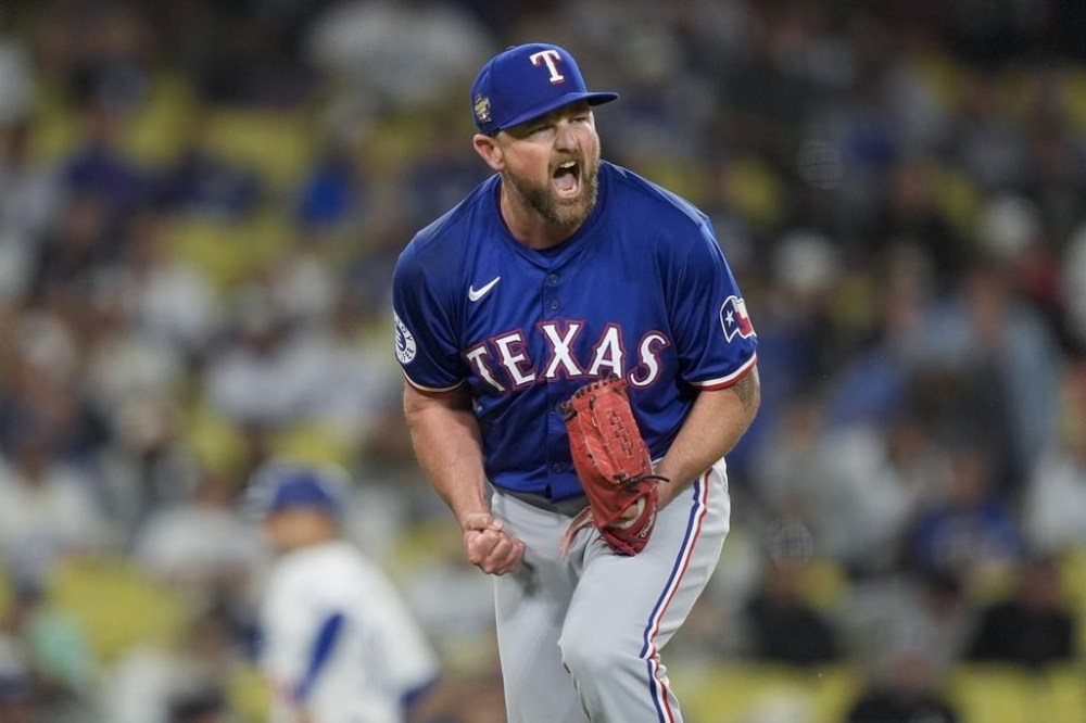 Texas Rangers relief pitcher Kirby Yates reacts after striking out Los Angeles Dodgers' Will Smith for the final out of a baseball game Thursday, June 13, 2024, in Los Angeles. (AP Photo/Ryan Sun)