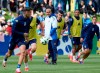 Italy's head coach Luciano Spalletti, center, follows the Italian national soccer team's public training session in Iserlohn, Germany, Tuesday, June 11, 2024. (Bernd Thissen/dpa via AP)