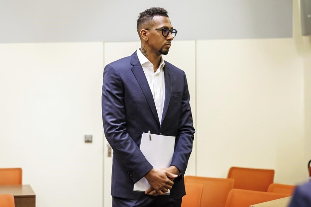 Jerome Boateng, professional soccer player, stands in a courtroom at Munich Regional Court at the start of his trial where he is accused of assaulting his ex-partner, in Munich, Germany, Friday, June 14, 2024. Boateng was convicted of assault and ordered to pay 1.2 million euros to his former partner in November 2022. That decision was recently overturned because of legal errors and the process must be restarted. (Matthias Balk/dpa via AP)