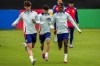 Spain's Pedri, center, and his teammate Spain's Nico Williams, right, take part in a training session at their base camp in Donaueschingen, Germany, Friday, June 14, 2024, ahead of their Group B soccer match against Croatia at the Euro 2024 soccer tournament. (AP Photo/Manu Fernandez)