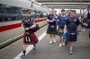 A man plays bagpipes as passengers cheer after disembarking from a train in Munich before a Group A match between Germany and Scotland at the Euro 2024 soccer tournament in Germany, Friday, June 14, 2024. (AP Photo/Markus Schreiber)