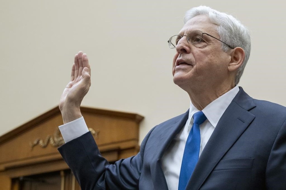 FILE - Attorney General Merrick Garland is sworn-in during a House Judiciary Committee hearing on the Department of Justice, June 4, 2024, on Capitol Hill in Washington. The Justice Department says Garland will not be prosecuted for contempt of Congress after refusing to turn over audio of President Joe Biden's interview in his classified documents case because his actions