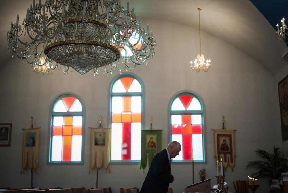 An elderly man pauses before Sunday service at St. George's Ukrainian Orthodox Church, in Dauphin, Man., Sunday, June 18, 2023. A ceremony is set for Saturday afternoon to remember 17 people who died in a bus crash in western Manitoba on June 15, 2023. THE CANADIAN PRESS/Darryl Dyck