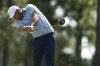 Brooks Koepka hits his tee shot on the 11th hole during the first round of the U.S. Open golf tournament Thursday, June 13, 2024, in Pinehurst, N.C. (AP Photo/Matt York)