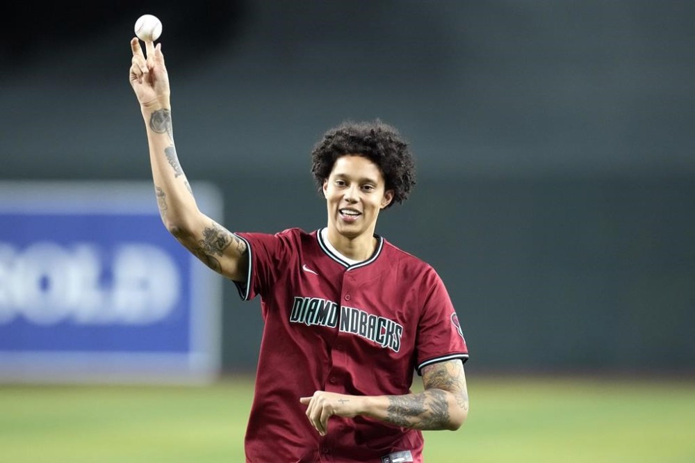 Phoenix Mercury WNBA basketball player Brittney Griner throws out the first pitch prior to a baseball game between the Arizona Diamondbacks and the Chicago White Sox, Friday, June 14, 2024, in Phoenix. (AP Photo/Ross D. Franklin)