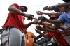 Philadelphia Phillies' Bryce Harper, left, gives autographs to young fans before a baseball game against the Baltimore Orioles, Friday, June 14, 2024, in Baltimore. (AP Photo/Terrance Williams)