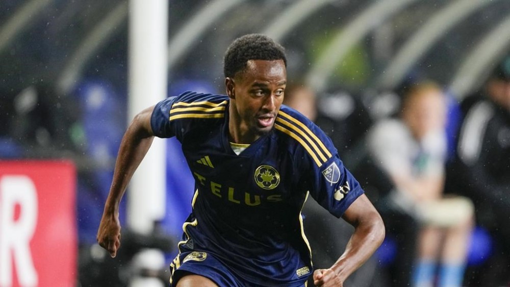 Vancouver Whitecaps forward Ali Ahmed runs against the Seattle Sounders during the second half of an MLS soccer match Saturday, May 18, 2024, in Seattle. TTHE CANADIAN PRESS/AP-Lindsey Wasson