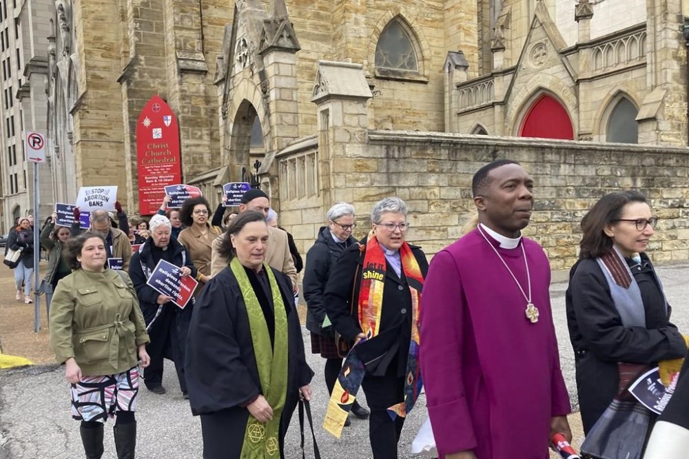 FILE - Clergy who filed suit seeking to overturn Missouri's abortion law and other opponents of the law hold a March through downtown St. Louis on Thursday, Jan. 19, 2023. On Friday, June 14, 2024, a judge in Missouri said lawmakers who passed a restrictive abortion ban weren't trying to impose their religious beliefs on everyone in the state, rejecting a case filed by more than a dozen Christian, Jewish and Unitarian Universalist leaders who support abortion rights. (AP Photo/Jim Salter, File)