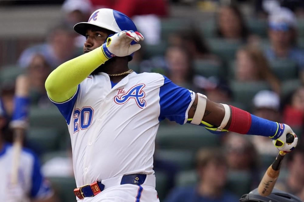 Atlanta Braves designated hitter Marcell Ozuna follows through on a home run in the fifth inning of a baseball game against the Tampa Bay Rays Saturday, June 15, 2024, in Atlanta. (AP Photo/John Bazemore)