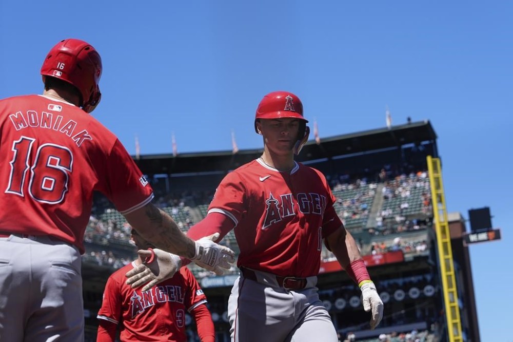Los Angeles Angels' Logan O'Hoppe, right, celebrates with Mickey Moniak (16) after hitting a two-run home run against the San Francisco Giants during the sixth inning of a baseball game Saturday, June 15, 2024, in San Francisco. (AP Photo/Godofredo A. Vásquez)