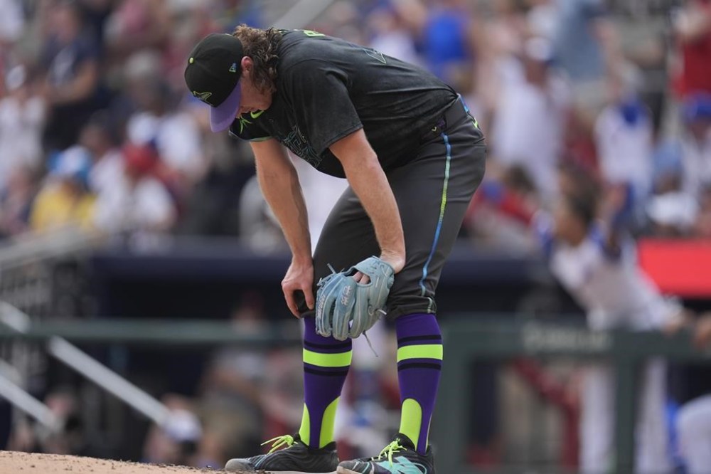Tampa Bay Rays pitcher Ryan Pepiot reacts after giving up a solo home run to Atlanta Braves' Matt Olson in the fifth inning of a baseball game Saturday, June 15, 2024, in Atlanta. Olson's homer was the third of the inning for the Braves. (AP Photo/John Bazemore)