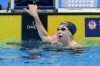 Gretchen Walsh reacts to her world record in her Women's 100 butterfly semifinals heat Saturday, June 15, 2024, at the US Swimming Olympic Trials in Indianapoils. (AP Photo/Darron Cummings)